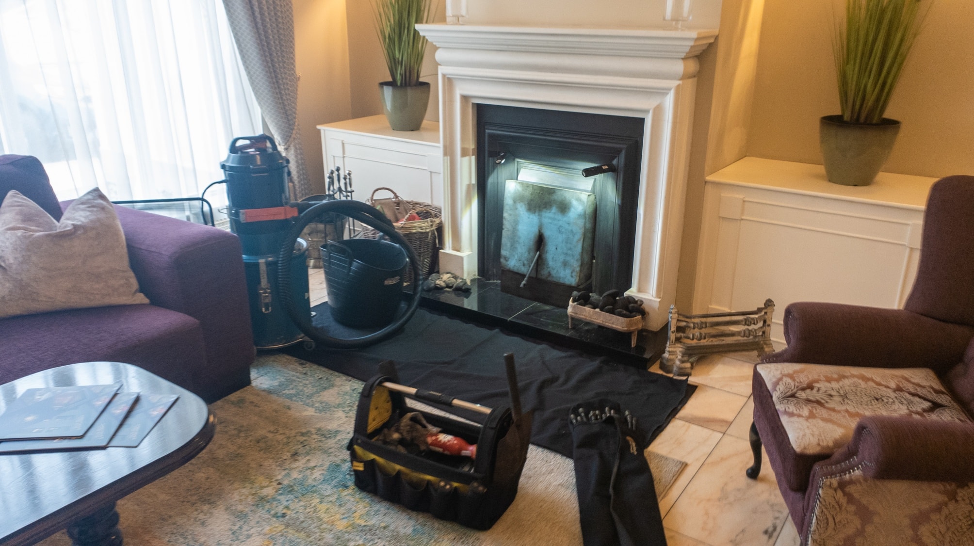 Living room protected during stove flue cleaning
